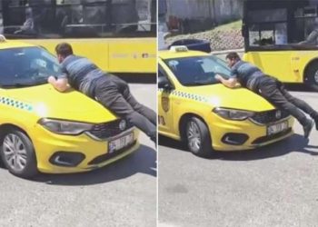 Pendik’te kazanın akabinde taksinin üstüne çıkıp camı yumrukladı