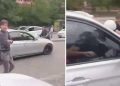 Tartıştığı motokuryeyi arabanın kaputunda sürükledi